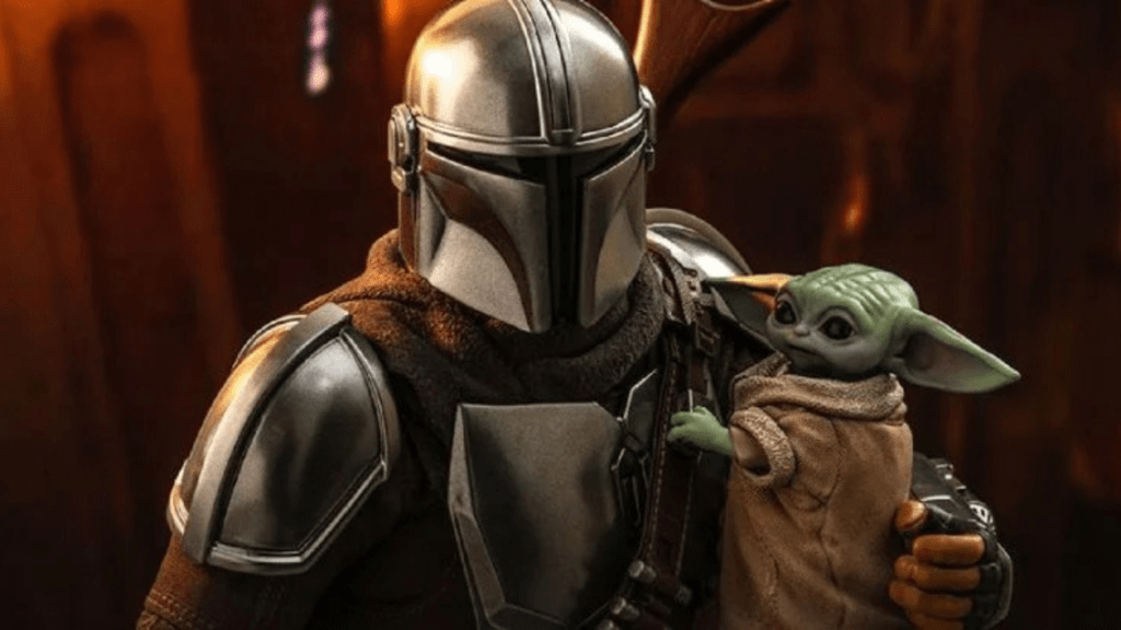 The mandalorian dans son armure tenant bébé Yoda dans ses bras