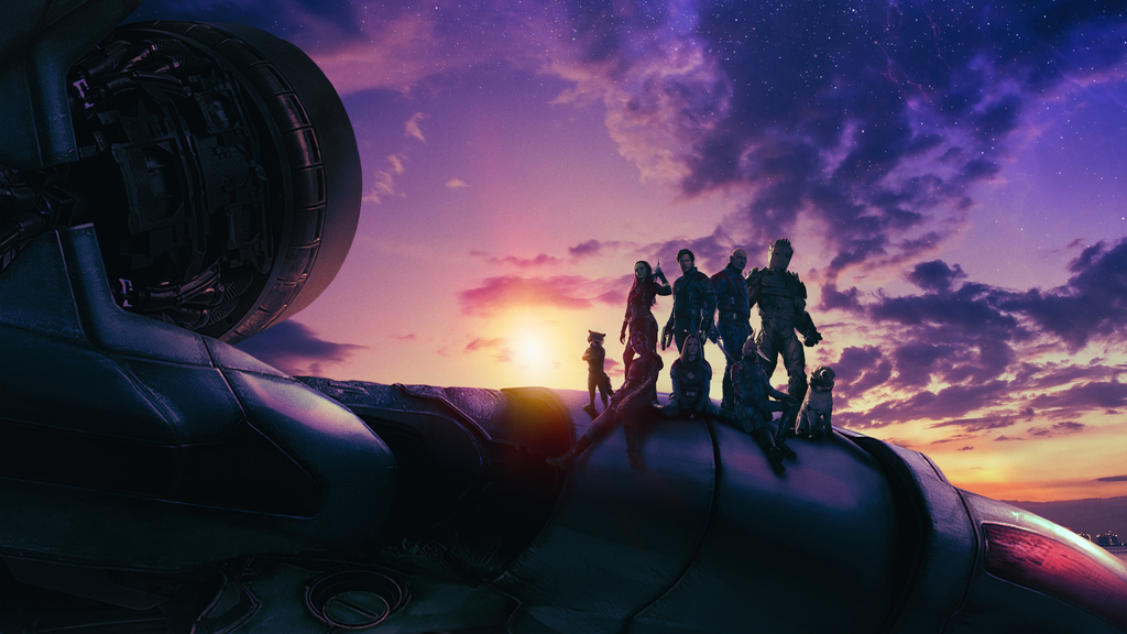Les Gardiens de la Galaxie sur le toit de leur vaisseau au soleil couchant. Le ciel est étoilé.