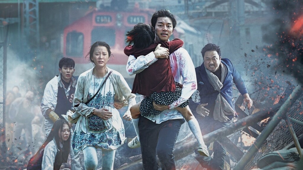 Personnages fuyant devant des zombies.